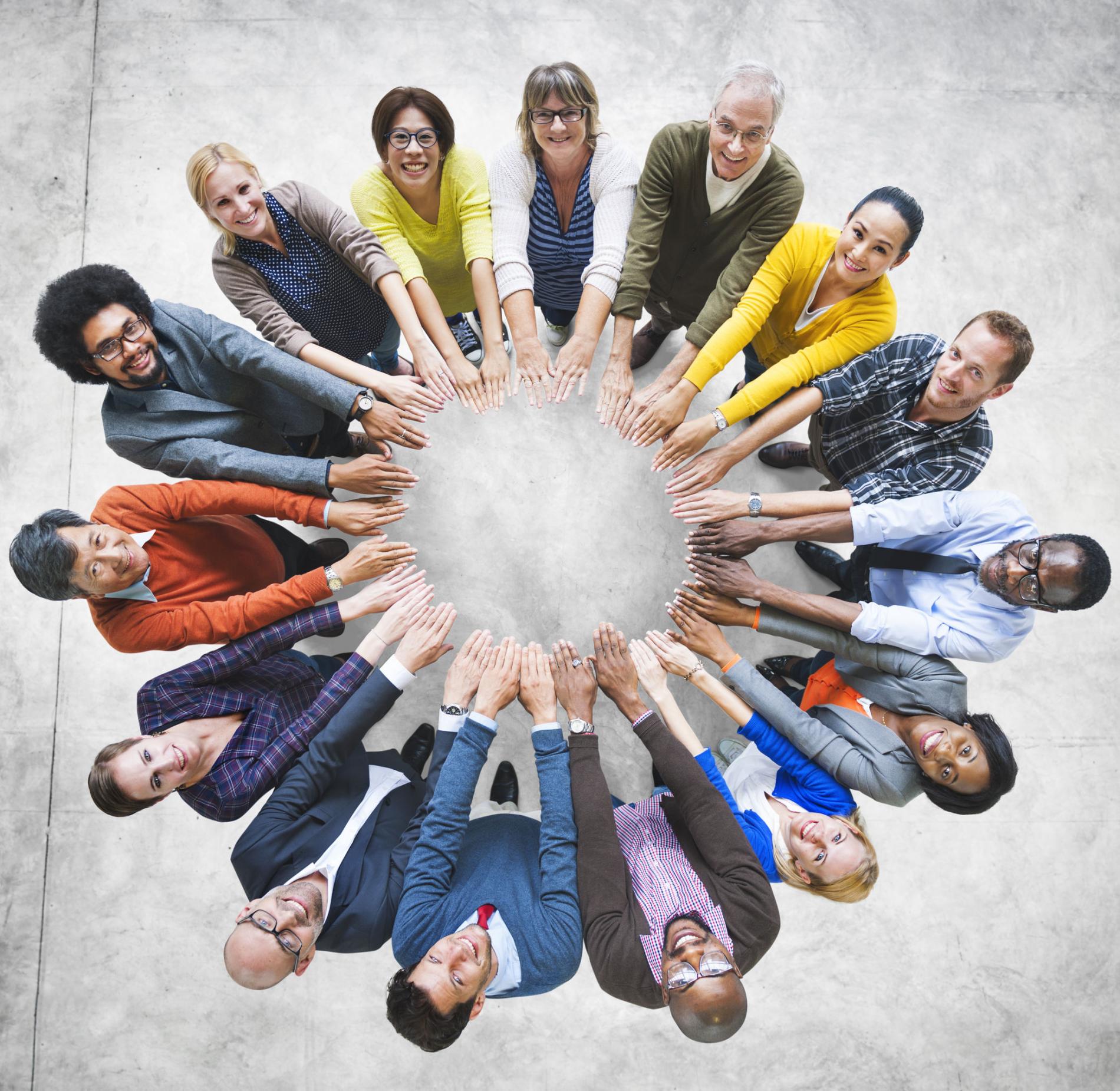 Diverse Adults in a circle with outstretched arms