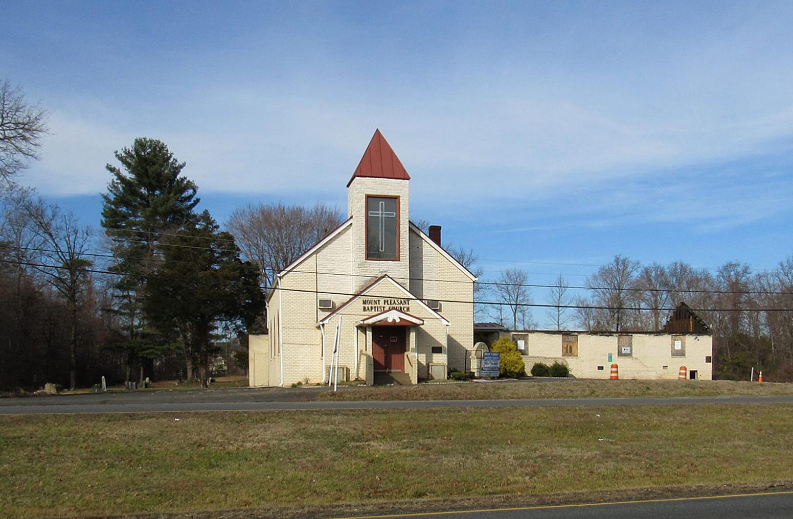 Image of a white church with a red roof