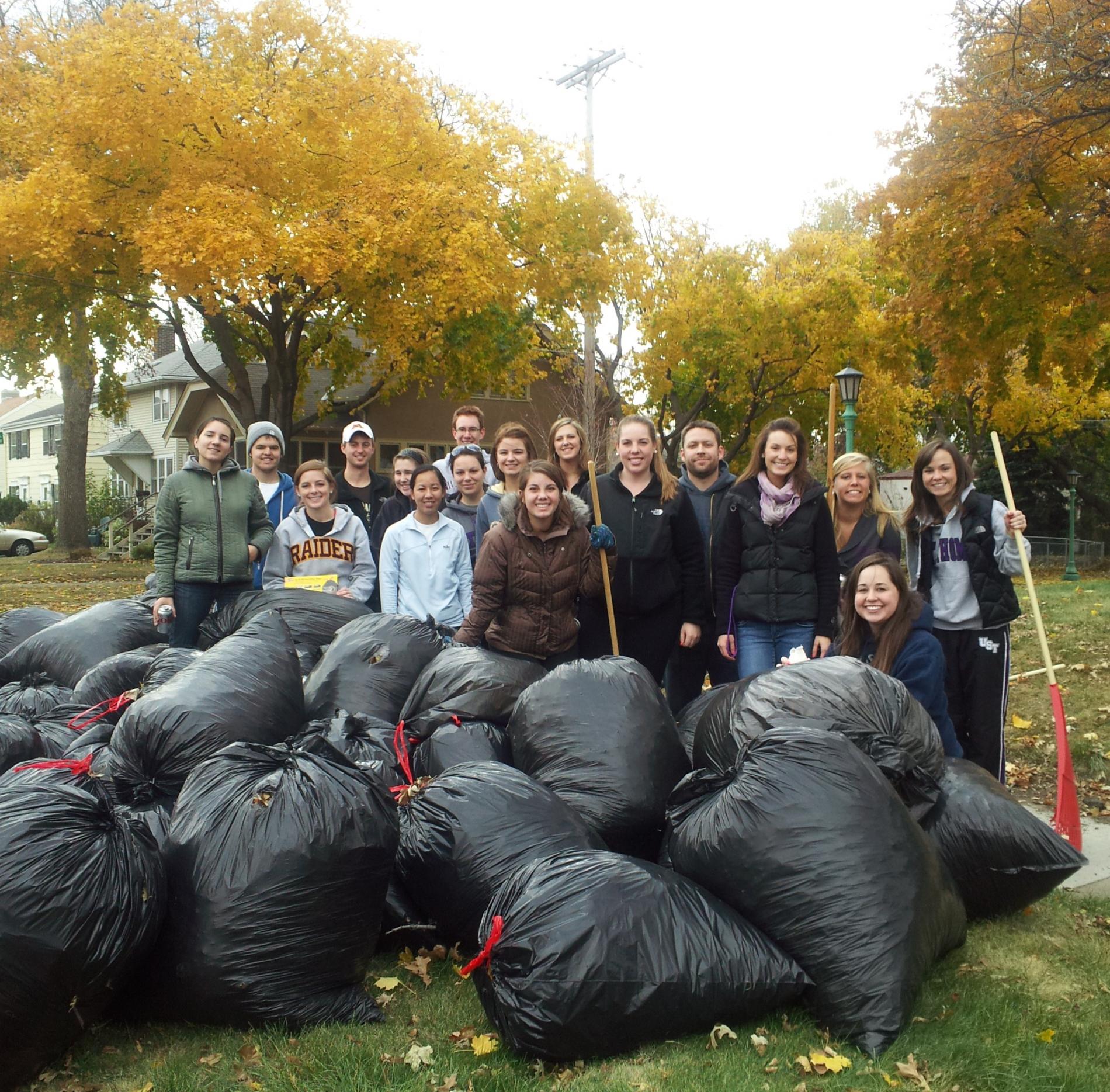 Group in front of trash