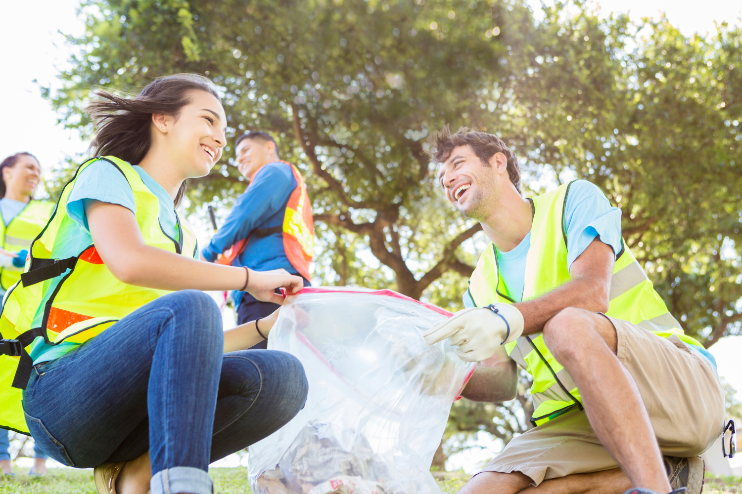 Couple cleaning up litter