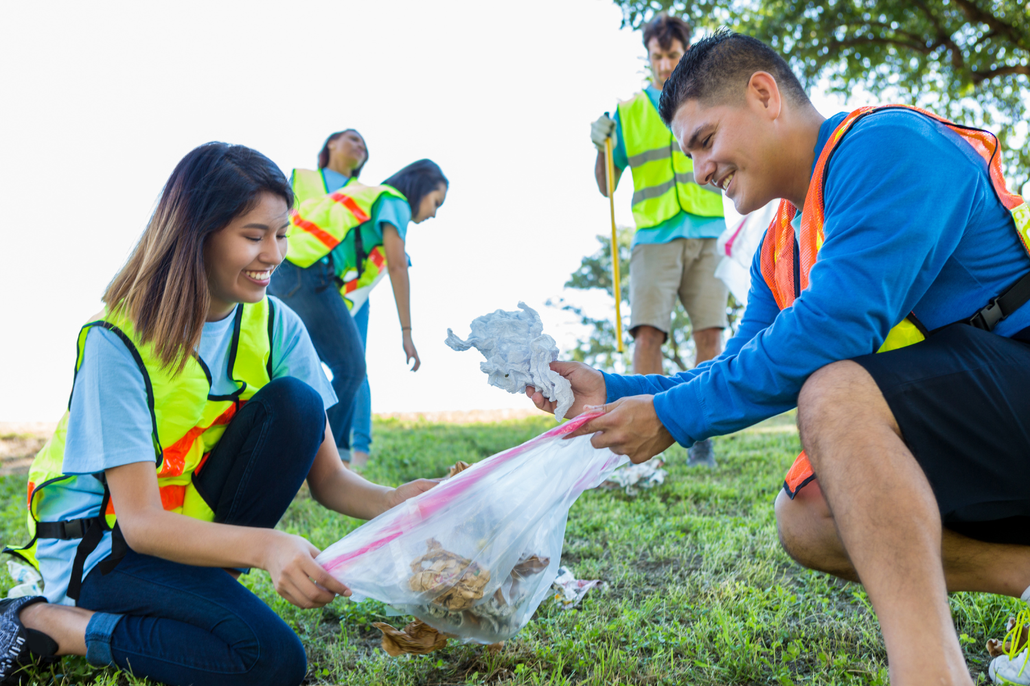 Young people cleaning up litter