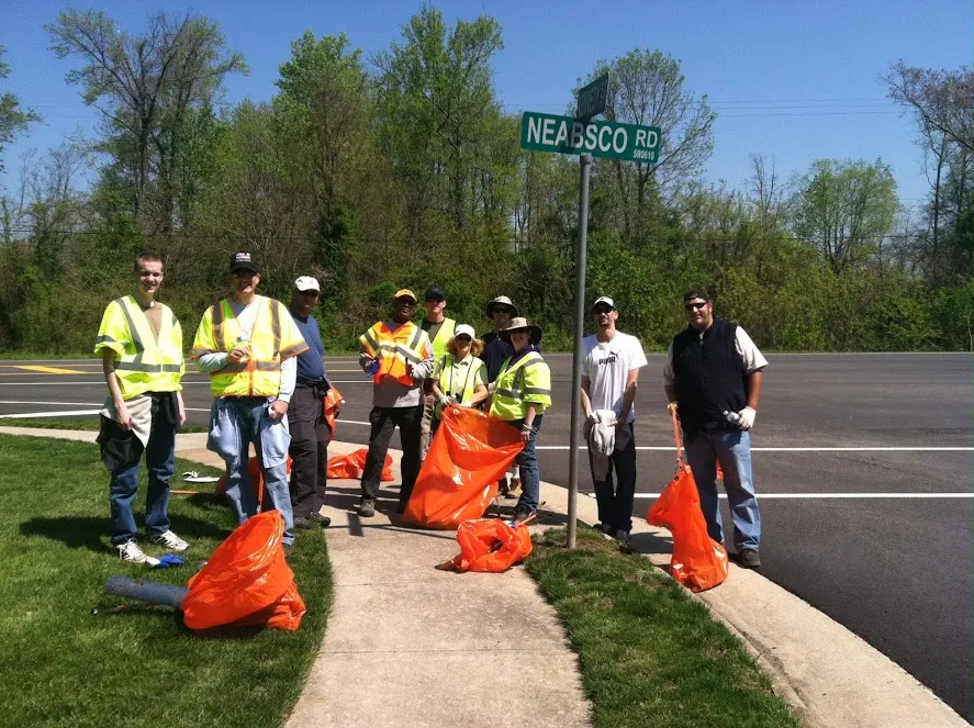 Litter Volunteers under street sign