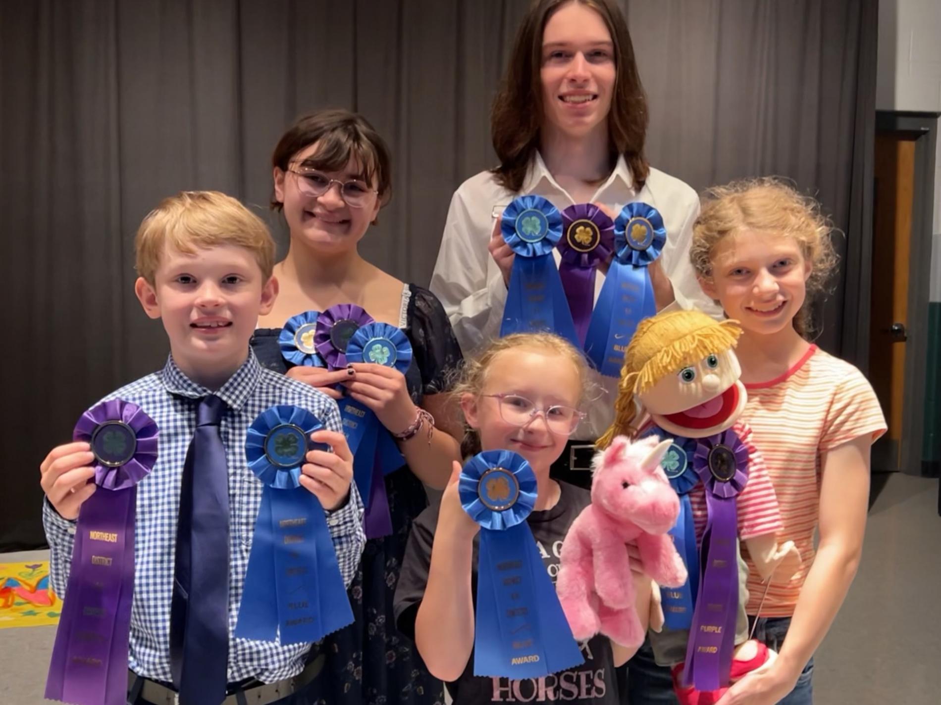 Prince William 4-H'ers holding their ribbons earned at Virginia 4-H Northeast District Contest Day.